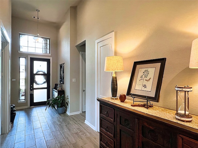 2 Ruchill Cir, Conroe, TX 77304 - foyer with a high ceiling and light wood-style floors