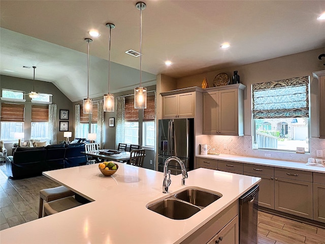 2 Ruchill Cir, Conroe, TX 77304 - kitchen featuring refrigerator with ice dispenser, dishwashing machine, gray cabinets, light wood-style floors, and recessed lighting