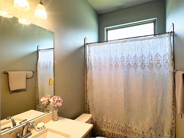 2 Ruchill Cir, Conroe, TX 77304 - bathroom featuring vanity and a textured wall