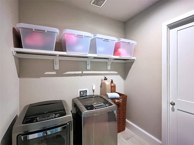 2 Ruchill Cir, Conroe, TX 77304 - washroom featuring washing machine and dryer and baseboards