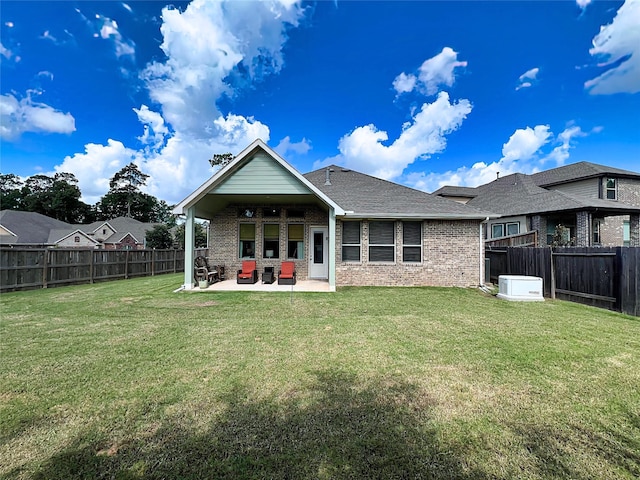 2 Ruchill Cir, Conroe, TX 77304 - rear view of property with a patio area, a fenced backyard, brick siding, and a shingled roof