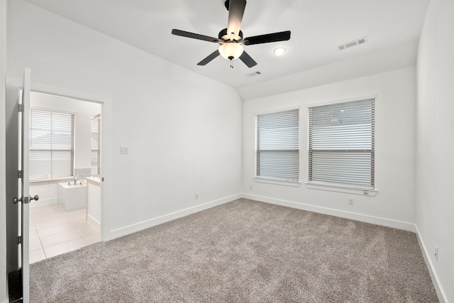 7810 Starfish Arbor Dr, Cypress, TX 77433 - spare room with light colored carpet, ceiling fan, plenty of natural light, and light tile patterned floors