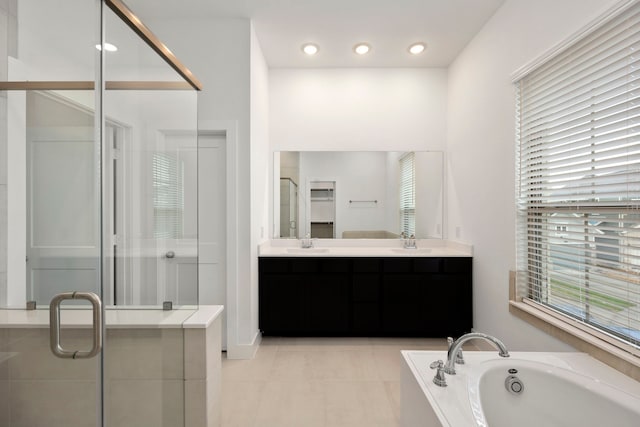 7810 Starfish Arbor Dr, Cypress, TX 77433 - full bathroom with a shower stall, double vanity, a bath, tile patterned flooring, and recessed lighting