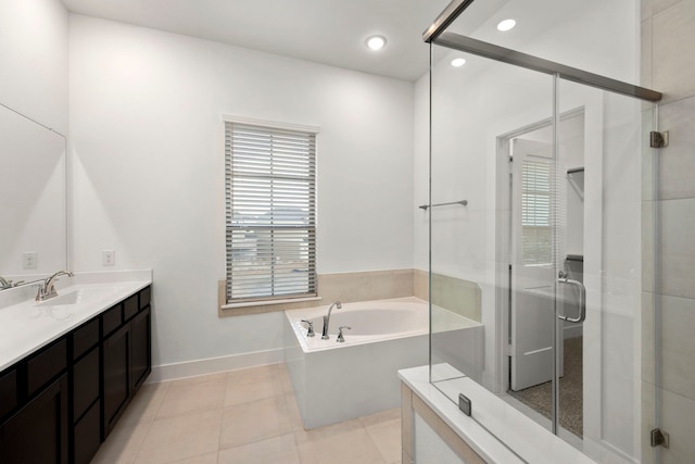 7810 Starfish Arbor Dr, Cypress, TX 77433 - bathroom with vanity, a bath, a stall shower, tile patterned flooring, and recessed lighting