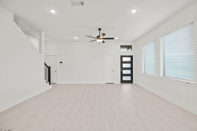 7810 Starfish Arbor Dr, Cypress, TX 77433 - unfurnished living room featuring recessed lighting, ceiling fan, stairway, and light wood-style flooring