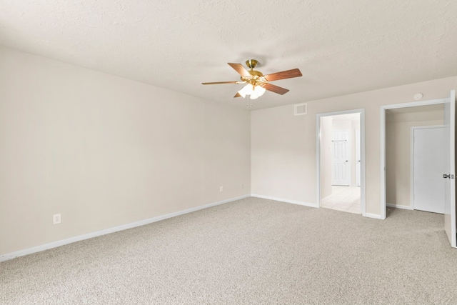 3735 Pineleaf Dr, Houston, TX 77068 - spare room with a ceiling fan, light carpet, and a textured ceiling