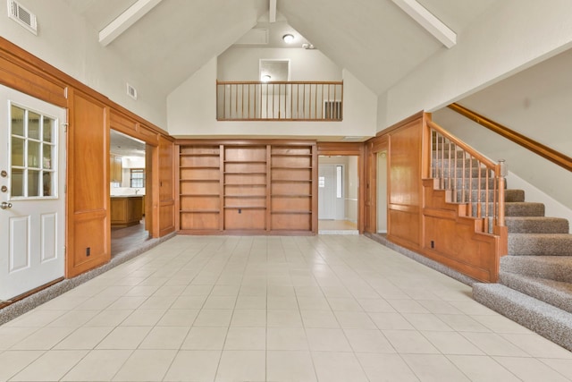 3735 Pineleaf Dr, Houston, TX 77068 - foyer with high vaulted ceiling, beamed ceiling, stairs, and light tile patterned floors