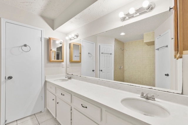 3735 Pineleaf Dr, Houston, TX 77068 - bathroom with double vanity, tile patterned flooring, and tiled shower