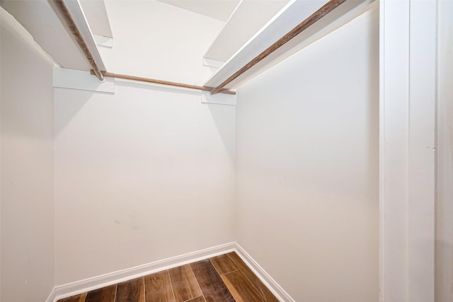 10659 Hazelhurst Dr, Houston, TX 77043 - walk in closet featuring dark wood finished floors