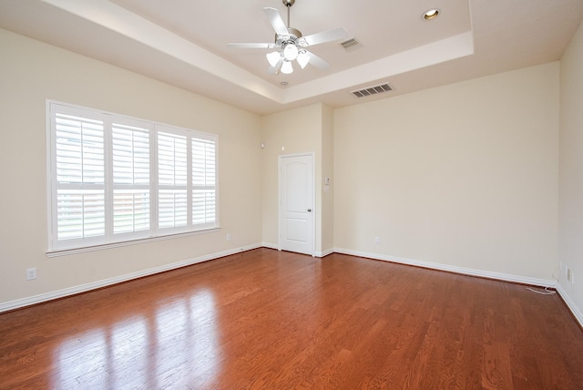 3315 Tulip Ranch Dr, Katy, TX 77494 - spare room featuring a tray ceiling, wood finished floors, and ceiling fan