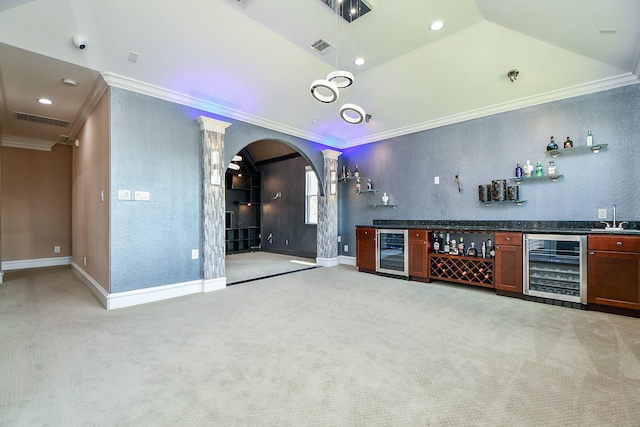 25518 Millbrook Bend Ln, Katy, TX 77494 - cinema room featuring wine cooler, ornamental molding, arched walkways, bar area, and light carpet