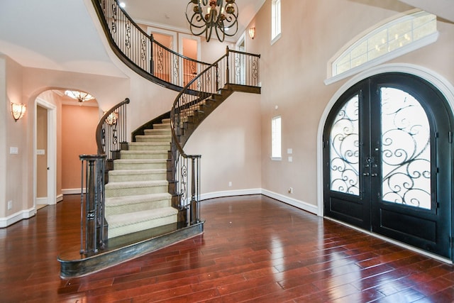 25518 Millbrook Bend Ln, Katy, TX 77494 - foyer featuring arched walkways, a chandelier, french doors, stairs, and a high ceiling