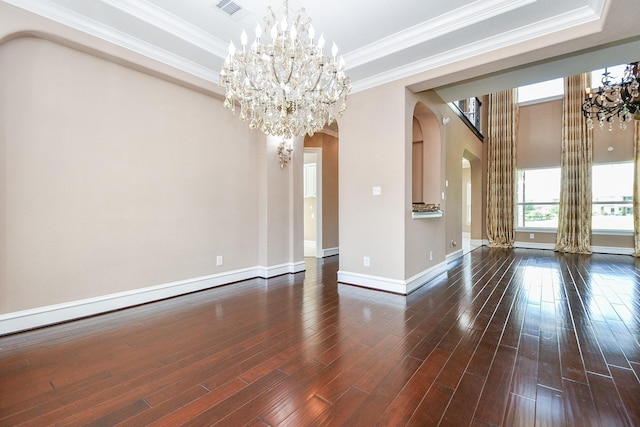 25518 Millbrook Bend Ln, Katy, TX 77494 - unfurnished living room featuring arched walkways, a chandelier, a raised ceiling, hardwood / wood-style floors, and crown molding