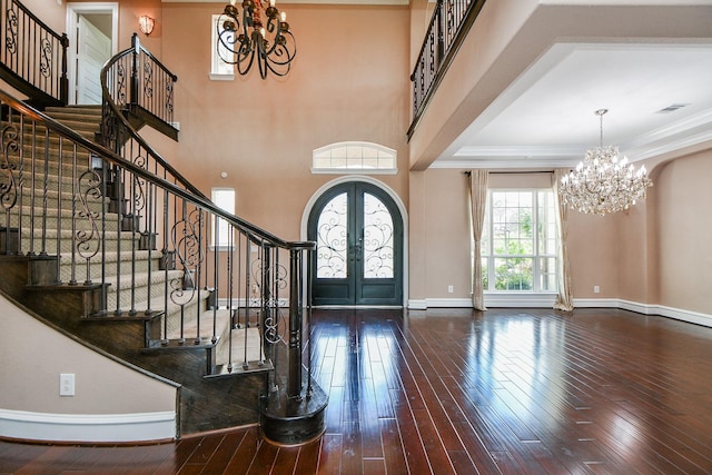 25518 Millbrook Bend Ln, Katy, TX 77494 - entryway featuring a chandelier, french doors, wood-type flooring, stairway, and ornamental molding
