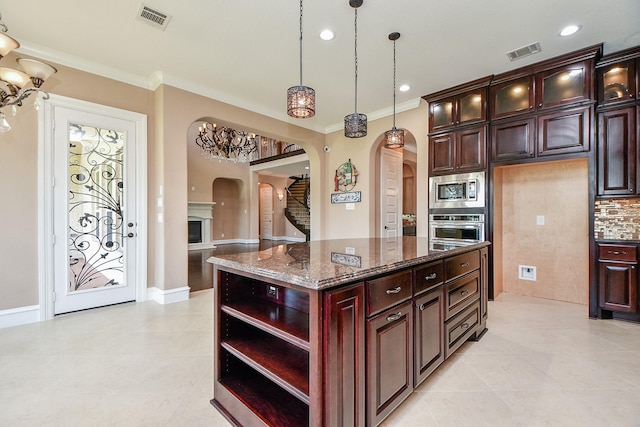 25518 Millbrook Bend Ln, Katy, TX 77494 - kitchen with arched walkways, appliances with stainless steel finishes, open shelves, crown molding, and light tile patterned flooring
