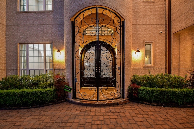 25518 Millbrook Bend Ln, Katy, TX 77494 - view of exterior entry featuring brick siding and a gate