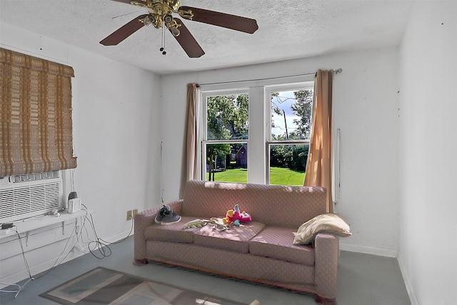 531 Circle Dr, La Porte, TX 77571 - living area with a textured ceiling, cooling unit, and ceiling fan