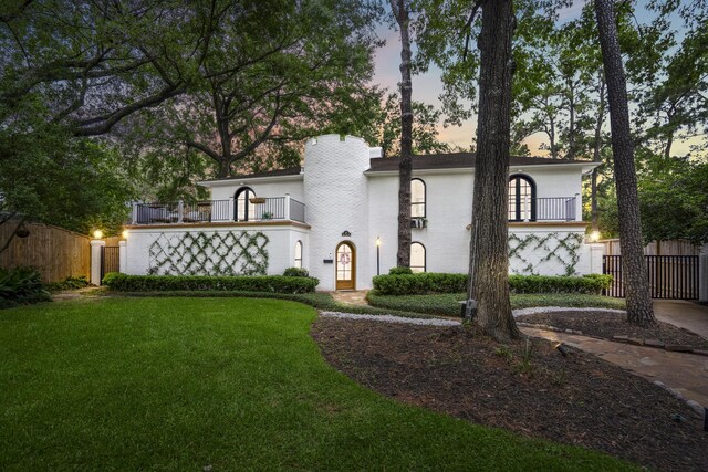 11 Twin Circle Dr, Houston, TX 77042 - view of front of property featuring a balcony, a chimney, and stucco siding