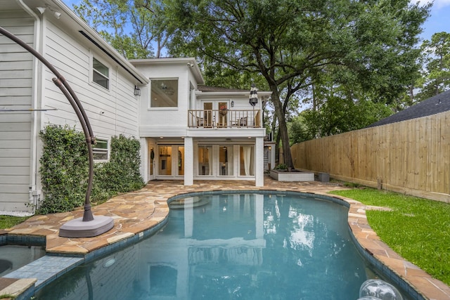11 Twin Circle Dr, Houston, TX 77042 - back of house with a balcony, a fenced backyard, and a patio area