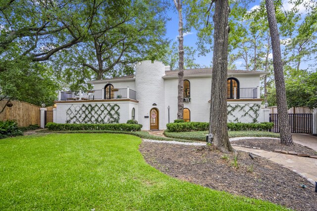 11 Twin Circle Dr, Houston, TX 77042 - mediterranean / spanish-style house with a balcony