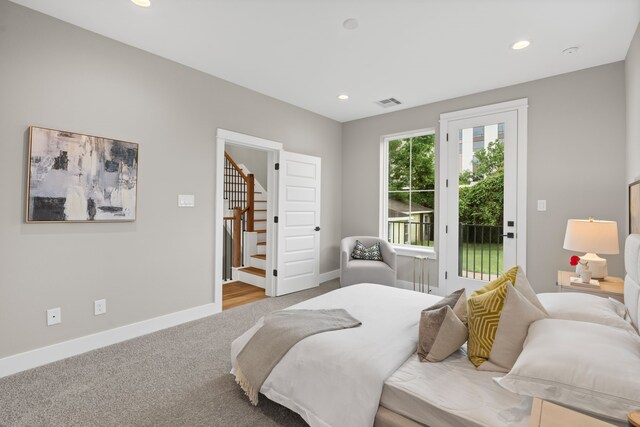 1193 W 19th St, Houston, TX 77008 - carpeted bedroom featuring access to exterior and recessed lighting