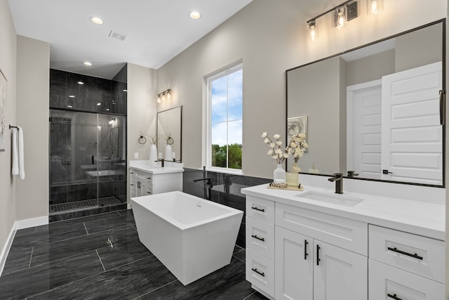 1193 W 19th St, Houston, TX 77008 - bathroom with a shower stall, two vanities, a freestanding tub, recessed lighting, and marble finish floors