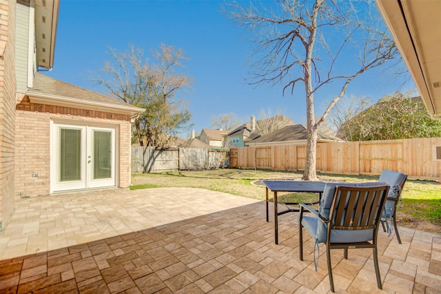 11715 Orchard Mountain Dr, Pasadena, TX 77059 - fenced backyard featuring french doors, a patio area, and outdoor dining area