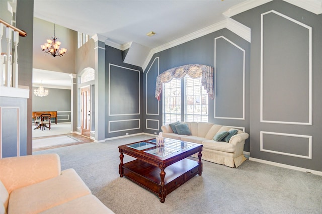 11715 Orchard Mountain Dr, Pasadena, TX 77059 - living room featuring a chandelier, ornamental molding, carpet flooring, ornate columns, and a decorative wall