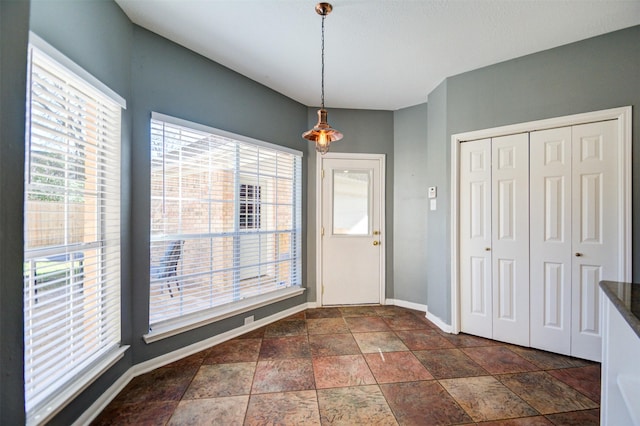 11715 Orchard Mountain Dr, Pasadena, TX 77059 - unfurnished dining area with baseboards and dark stone finish flooring