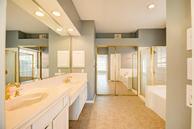 11715 Orchard Mountain Dr, Pasadena, TX 77059 - full bathroom with a bath, double vanity, recessed lighting, a shower stall, and tile patterned flooring