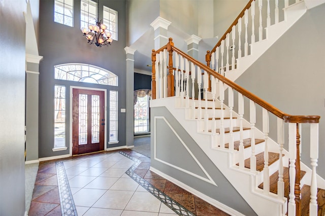 11715 Orchard Mountain Dr, Pasadena, TX 77059 - entryway featuring a high ceiling, healthy amount of natural light, inlaid floor details, stairway, and a chandelier