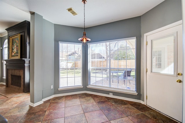 11715 Orchard Mountain Dr, Pasadena, TX 77059 - unfurnished dining area with a fireplace and dark stone finish flooring