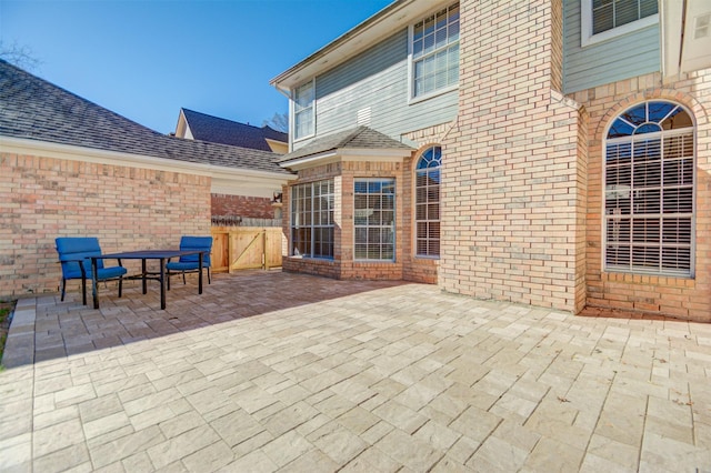 11715 Orchard Mountain Dr, Pasadena, TX 77059 - view of patio with a gate and outdoor dining area