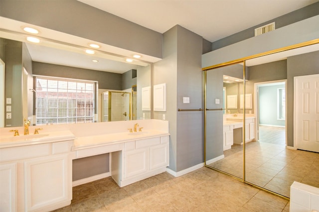11715 Orchard Mountain Dr, Pasadena, TX 77059 - full bathroom featuring double vanity, a stall shower, recessed lighting, and tile patterned flooring