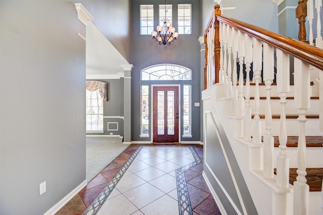 11715 Orchard Mountain Dr, Pasadena, TX 77059 - foyer entrance featuring inlaid floor details, a high ceiling, a chandelier, and stairs