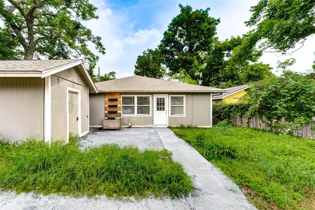 224 Maddox St, Clute, TX 77531 - view of front of home featuring an outdoor structure and a chimney