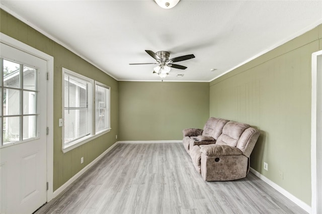 224 Maddox St, Clute, TX 77531 - sitting room featuring light wood-style flooring, ceiling fan, and crown molding