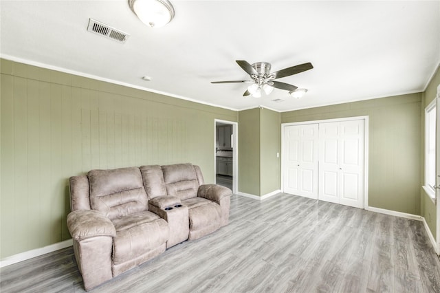 224 Maddox St, Clute, TX 77531 - living room with wood finished floors, a ceiling fan, and crown molding