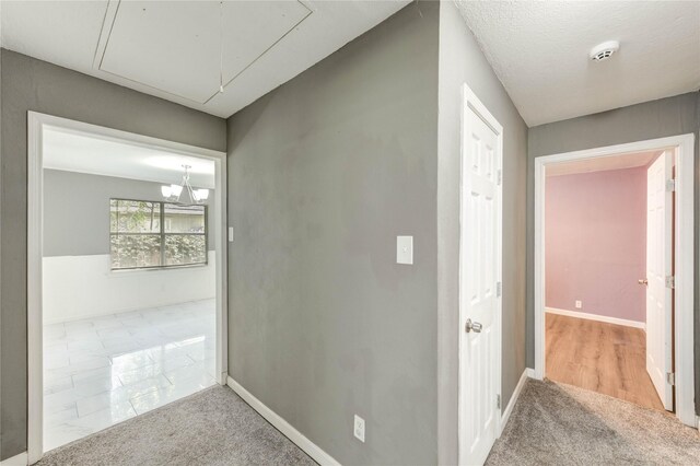 224 Maddox St, Clute, TX 77531 - corridor featuring attic access and carpet flooring