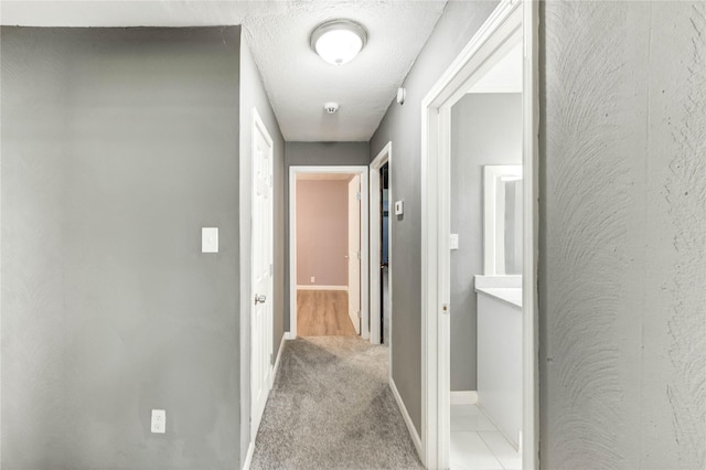 224 Maddox St, Clute, TX 77531 - hallway featuring baseboards and carpet floors