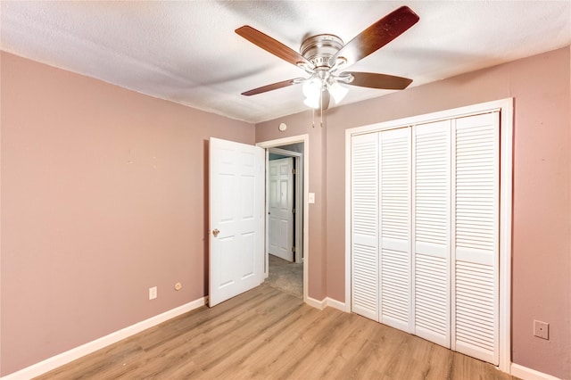 224 Maddox St, Clute, TX 77531 - unfurnished bedroom featuring light wood-style floors, a closet, and ceiling fan