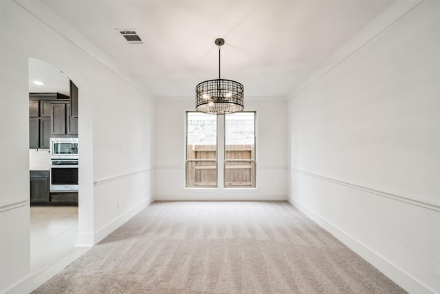17794 Misty Brook Ln, Conroe, TX 77302 - spare room featuring light carpet, a chandelier, and crown molding