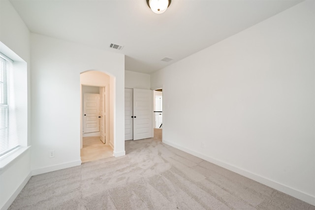 17794 Misty Brook Ln, Conroe, TX 77302 - unfurnished bedroom featuring arched walkways and carpet