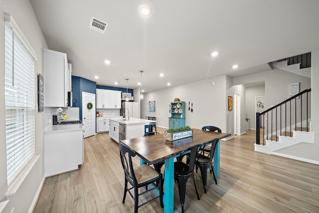 2218 Royal Ann Way, Tomball, TX 77375 - dining area featuring light wood-type flooring, recessed lighting, and stairway
