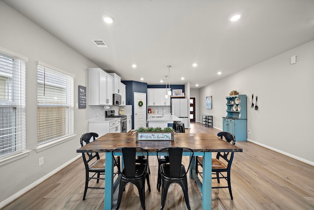 2218 Royal Ann Way, Tomball, TX 77375 - dining space with light wood-style floors and recessed lighting