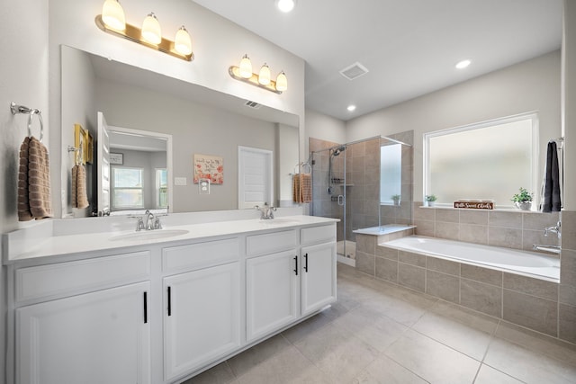 2218 Royal Ann Way, Tomball, TX 77375 - bathroom featuring double vanity, a shower stall, a garden tub, tile patterned flooring, and recessed lighting