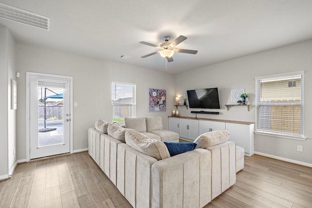 2218 Royal Ann Way, Tomball, TX 77375 - living area featuring light wood-style floors and ceiling fan