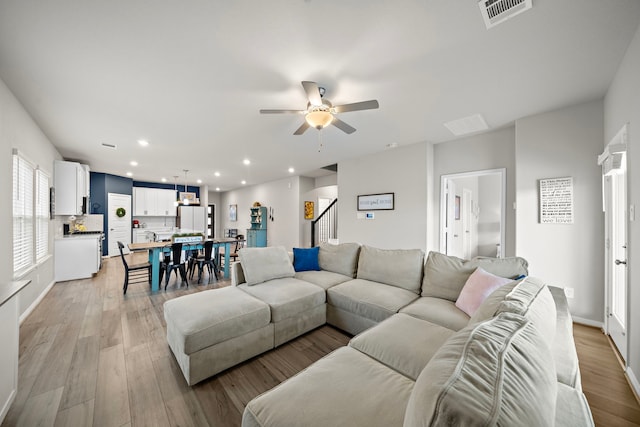 2218 Royal Ann Way, Tomball, TX 77375 - living room featuring ceiling fan, light wood-style floors, recessed lighting, and stairway
