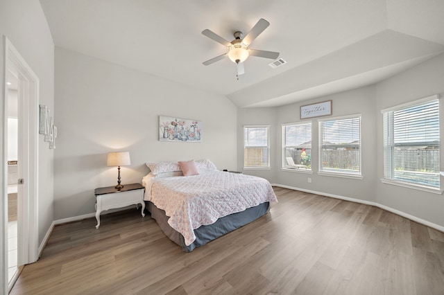 2218 Royal Ann Way, Tomball, TX 77375 - bedroom featuring wood finished floors, lofted ceiling, and a ceiling fan