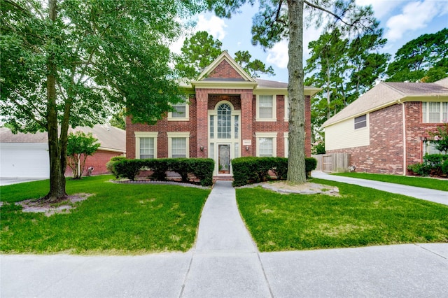 16023 Cutten Rd, Houston, TX 77070 - view of front of property with a front yard and brick siding